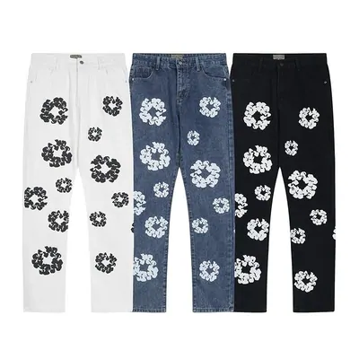 Jeans printed with white flower motifs, shown front and back