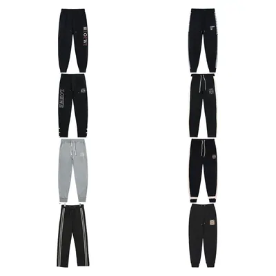 Joggers in black and grey laid out flat in two columns